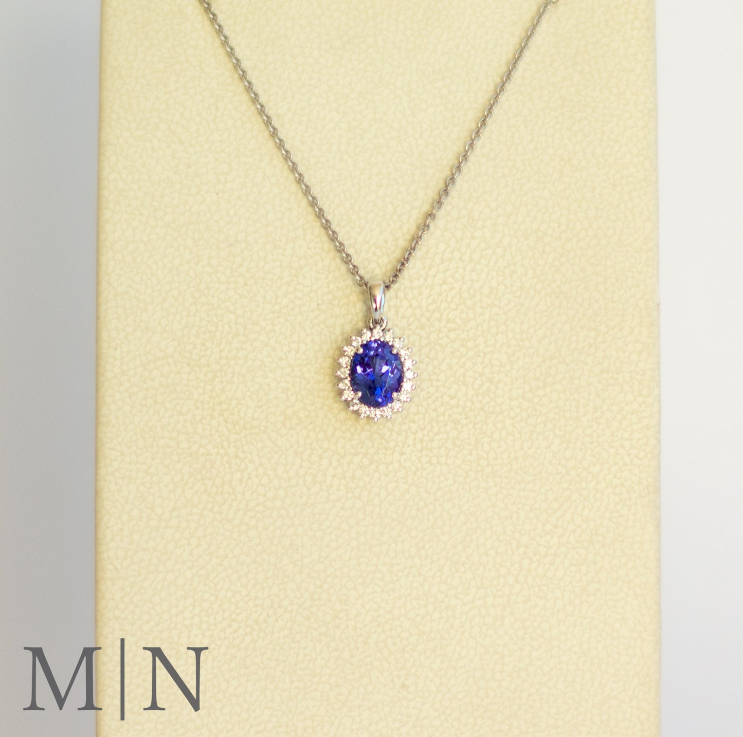 White Gold Tanzanite & Diamond Halo Pendant